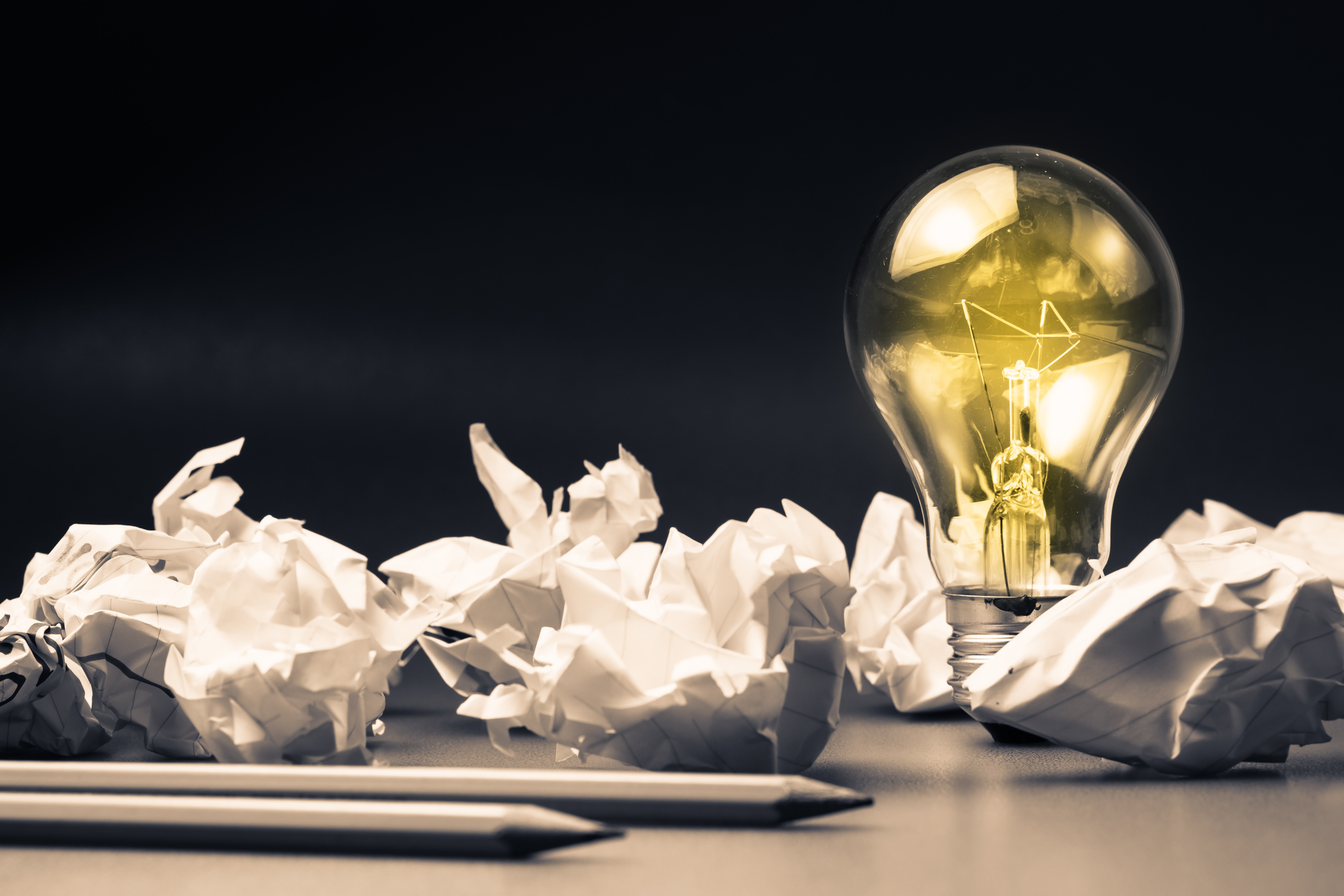 lightbulb and crumpled paper