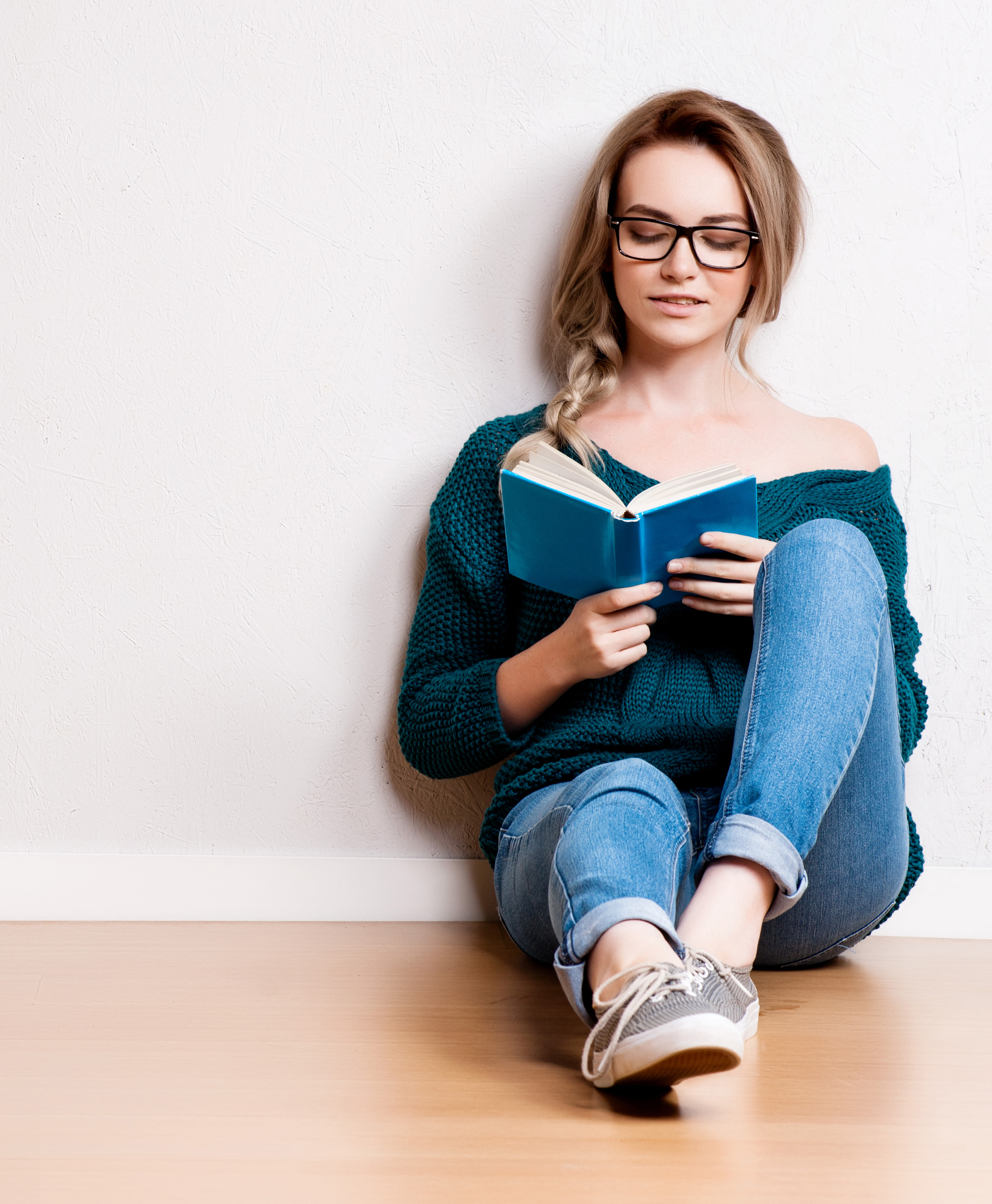woman in glasses reading